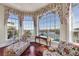 Charming sitting area offering scenic views, comfortable seating, and elegant decor at 1137 N Lake Shore Dr, Sarasota, FL 34231
