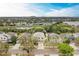 Aerial view of a beautiful neighborhood with a pond near the house at 11411 Flora Springs Dr, Riverview, FL 33579