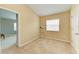 Bright bedroom with neutral walls and carpet, offering ample space for relaxation at 11411 Flora Springs Dr, Riverview, FL 33579