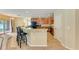 Eat-in kitchen with granite counters, a breakfast bar, and modern appliances at 11411 Flora Springs Dr, Riverview, FL 33579