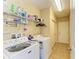 Laundry Room with tile flooring and modern appliances at 11411 Flora Springs Dr, Riverview, FL 33579