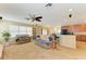 Open floor plan living room flowing into kitchen at 11411 Flora Springs Dr, Riverview, FL 33579