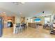 Open-concept kitchen flows into a bright and spacious living room at 11411 Flora Springs Dr, Riverview, FL 33579