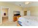 Another view of spacious main bedroom with access to a luxurious ensuite bathroom at 11411 Flora Springs Dr, Riverview, FL 33579