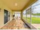 Enclosed patio with tile flooring and furniture at 11411 Flora Springs Dr, Riverview, FL 33579
