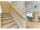 Carpeted staircase leading to the upper level of the home at 11411 Flora Springs Dr, Riverview, FL 33579