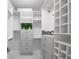 Customized walk-in closet with modern shelving, drawers, and ample storage space at 1280 Dolphin Bay Way # 402, Sarasota, FL 34242
