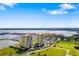 An aerial view of two residential high rise buildings overlooking the ocean at 130 Riviera Dunes Way # 1201, Palmetto, FL 34221
