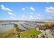 Aerial view of a marina and landscaping with blue sky at 130 Riviera Dunes Way # 1201, Palmetto, FL 34221