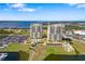 A high rise building with a stunning aerial view of the lake, boat docks, and manicured lawns at 130 Riviera Dunes Way # 1201, Palmetto, FL 34221