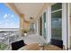 Balcony with seating and water views from a high-rise building at 130 Riviera Dunes Way # 1201, Palmetto, FL 34221