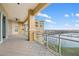 Spacious balcony with water views, plenty of room for seating, and beautiful blue skies at 130 Riviera Dunes Way # 1201, Palmetto, FL 34221