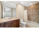 Bathroom featuring a bathtub, shower and wood vanity with a large mirror at 130 Riviera Dunes Way # 1201, Palmetto, FL 34221
