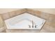 Close up of the bathroom featuring a white soaking tub with tile surround at 130 Riviera Dunes Way # 1201, Palmetto, FL 34221