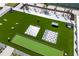 Aerial view of the community beach club with lawn games at 130 Riviera Dunes Way # 1201, Palmetto, FL 34221