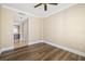 Bright bedroom with wood floors, neutral walls, and a ceiling fan at 130 Riviera Dunes Way # 1201, Palmetto, FL 34221