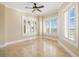 Inviting bedroom with shuttered windows, allowing natural light and providing a peaceful retreat within the home at 130 Riviera Dunes Way # 1201, Palmetto, FL 34221