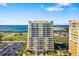Exterior view of a high-rise building featuring floor-to-ceiling windows with views at 130 Riviera Dunes Way # 1201, Palmetto, FL 34221