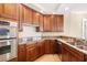Gourmet kitchen with ample counter space and stainless steel appliances perfect for cooking and entertaining guests at 130 Riviera Dunes Way # 1201, Palmetto, FL 34221