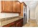 Stylish kitchen with stainless steel appliances, granite countertops, and modern cabinets providing a functional and aesthetic space at 130 Riviera Dunes Way # 1201, Palmetto, FL 34221