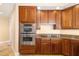 Well-appointed kitchen featuring built-in stainless steel appliances and custom cabinetry for a sophisticated aesthetic at 130 Riviera Dunes Way # 1201, Palmetto, FL 34221