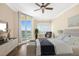 Bedroom with views, a sitting area, and stylish furnishings creates a relaxing space to unwind and enjoy the surroundings at 130 Riviera Dunes Way # 1201, Palmetto, FL 34221