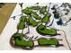 Aerial view of a winding miniature golf course with sand traps and palm trees at 130 Riviera Dunes Way # 1201, Palmetto, FL 34221
