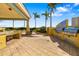 Full outdoor kitchen setup with stainless steel grills and sink at 130 Riviera Dunes Way # 1201, Palmetto, FL 34221