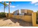 Well-equipped outdoor kitchen with stainless steel grills at 130 Riviera Dunes Way # 1201, Palmetto, FL 34221