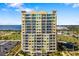 Luxury condominium offering stunning architecture, multiple balconies, and tropical landscaping at 130 Riviera Dunes Way # 902, Palmetto, FL 34221