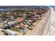 Aerial shot showcasing the beachfront condo's proximity to the beach and surrounding neighborhood at 1300 Gulf Blvd # 202, Indian Rocks Beach, FL 33785