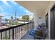 Relaxing balcony with seating and a peaceful view of the surrounding landscape at 1300 Gulf Blvd # 202, Indian Rocks Beach, FL 33785