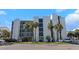 Multi-story condo building near the beach with private balconies and well-maintained landscaping at 1300 Gulf Blvd # 202, Indian Rocks Beach, FL 33785