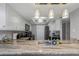 Spacious kitchen with granite countertops, stainless steel appliances, and stylish pendant lighting at 1300 Gulf Blvd # 202, Indian Rocks Beach, FL 33785