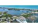 Stunning aerial view of waterfront community with lush greenery, boat docks, and beautiful ocean views at 14021 Bellagio Way # 309, Osprey, FL 34229