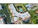 A bird's eye view of the building, pool, and the water that surrounds it at 14021 Bellagio Way # 309, Osprey, FL 34229