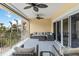 Spacious balcony features outdoor seating and ceiling fans, perfect for enjoying the view at 14021 Bellagio Way # 309, Osprey, FL 34229