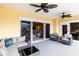 A large covered balcony with plenty of seating provides access to the living room and bedroom at 14021 Bellagio Way # 309, Osprey, FL 34229