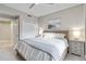 Bedroom showcasing a woven headboard and beach-themed wall decor above the bed at 14021 Bellagio Way # 309, Osprey, FL 34229
