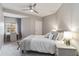Comfortable bedroom featuring a queen bed, a desk and soft, neutral colors at 14021 Bellagio Way # 309, Osprey, FL 34229