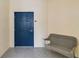 Inviting entrance features a bench and a blue door with unit number at 14021 Bellagio Way # 309, Osprey, FL 34229