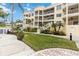 A beautiful view of this condo building and it's well manicured green space at 14021 Bellagio Way # 309, Osprey, FL 34229