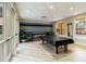 Bright game room features a pool table and comfortable seating at 14021 Bellagio Way # 309, Osprey, FL 34229