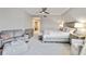 Spacious main bedroom with a ceiling fan, sitting area, and ensuite bathroom at 14021 Bellagio Way # 309, Osprey, FL 34229
