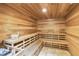 Relaxing sauna with wooden benches and paneling at 14021 Bellagio Way # 309, Osprey, FL 34229