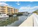 Condo building overlooking the water and a boat dock at 14021 Bellagio Way # 309, Osprey, FL 34229