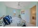 Cozy bedroom features a closet, window, and doorway to another room at 1407 Burgos Dr, Sarasota, FL 34238
