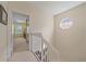 Hallway leading to bedrooms, with natural light from an octagon window and white trim at 1407 Burgos Dr, Sarasota, FL 34238
