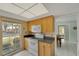 Well-lit kitchen with practical layout, ample counter space, and convenient access to dining area at 2 Antigua Cir # 4, Englewood, FL 34223