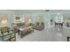 Airy living room with eye-catching tile floor, pastel-colored walls, and comfortable seating arrangement at 2 Antigua Cir # 4, Englewood, FL 34223